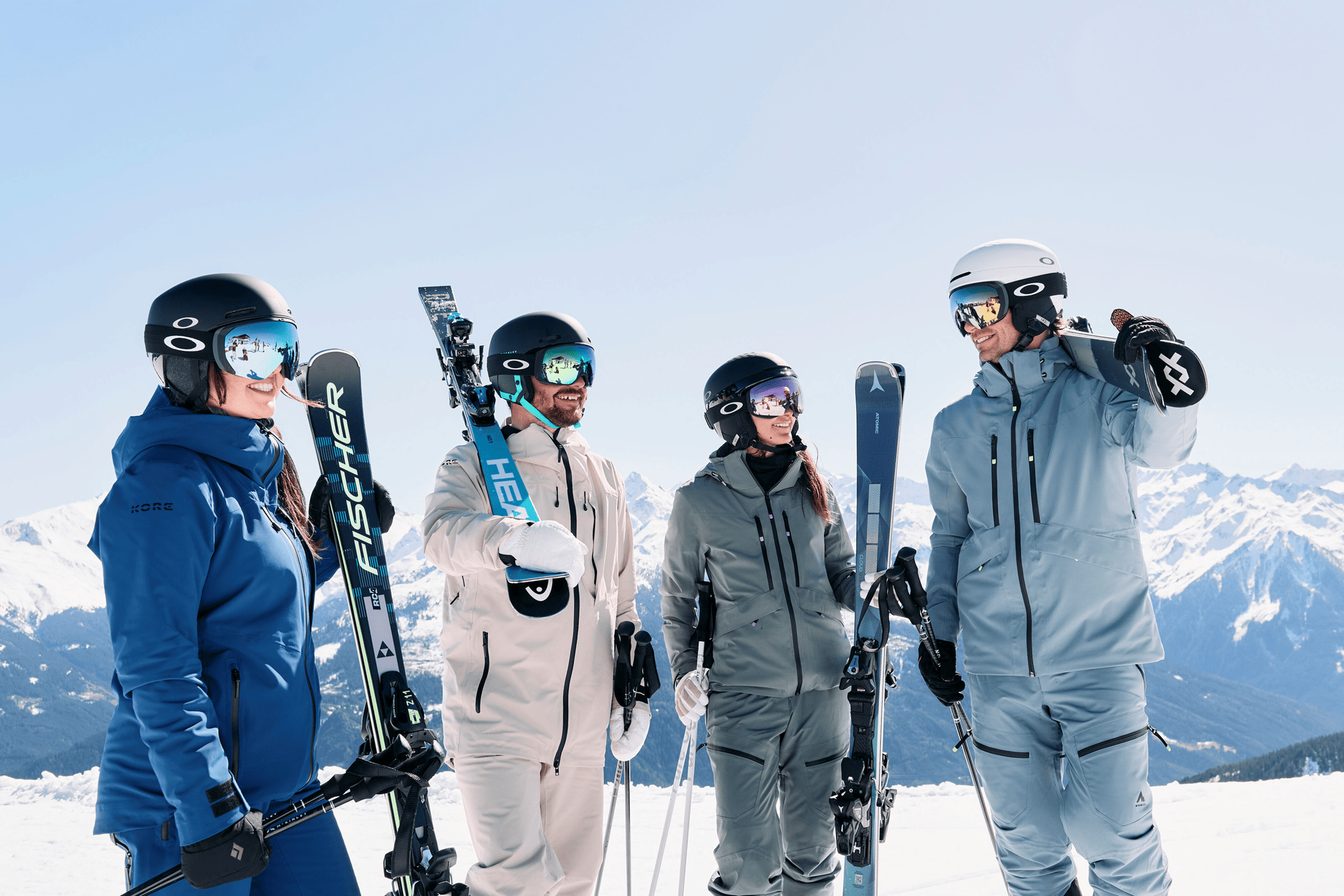 4 Skiers full equiped in winter mountains